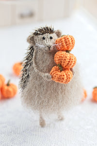 hedgehog with pumpkins